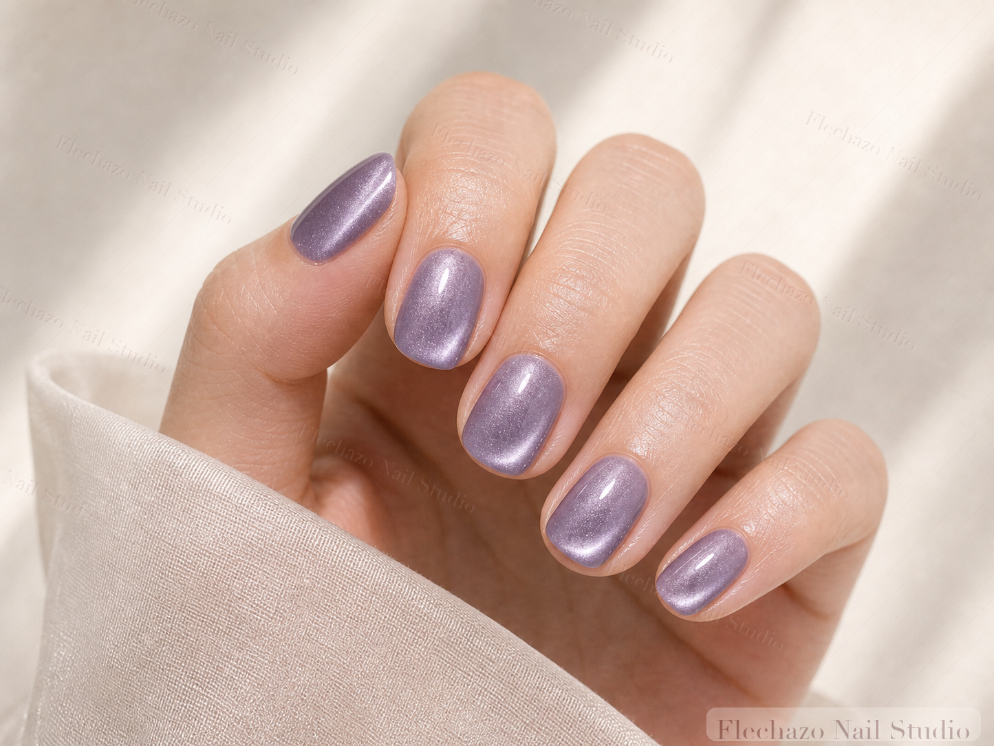 Smooth Cat Eye Gel Softly Press-On Nails worn on a model hand