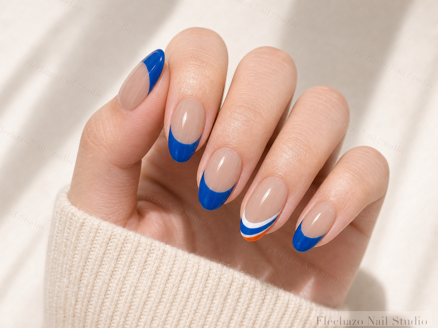 Nude Bold Royal Blue French Press-On Nails worn on a model hand