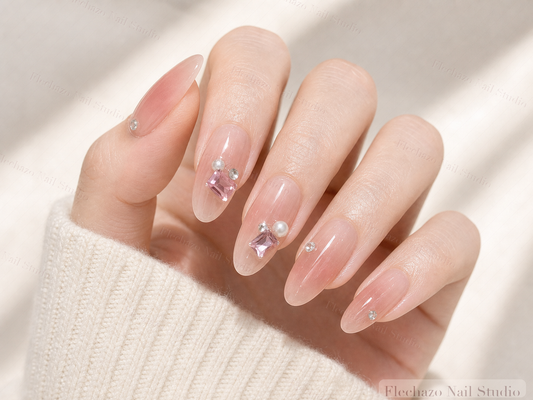 Blush Pink Floral Crystal Accent Press-On Nails worn on a model hand