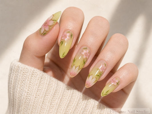 Sage Green Hand-Painted Floral Press-On Nails worn on a model hand