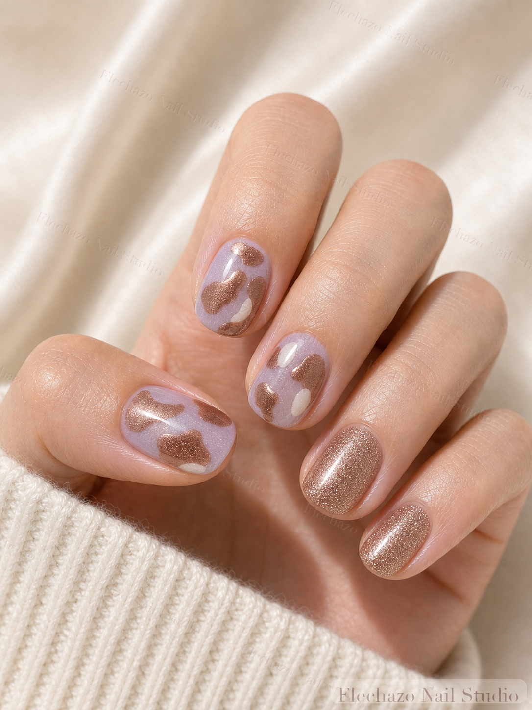 Mauve Rose Shimmer Abstract Wave Press-On Nails worn on a model hand