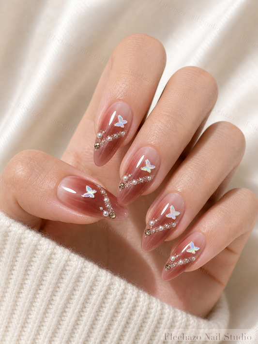 Burgundy Silver Bow Star Press-On Nails worn on a model hand