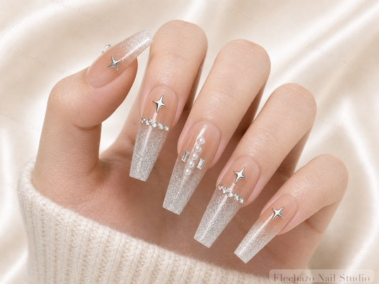 Nude Silver Star Crystal French Press-On Nails worn on a model hand