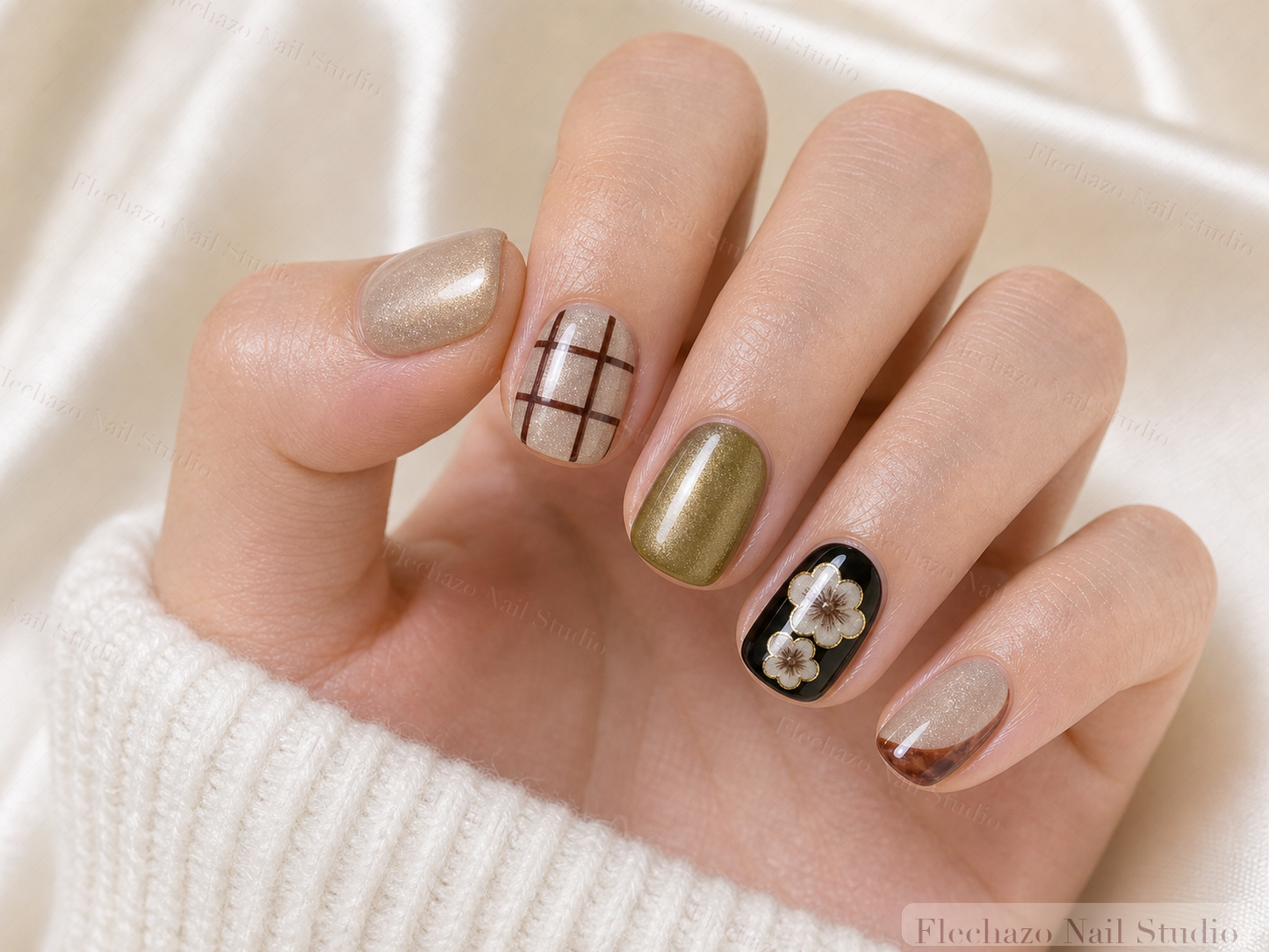 Champagne Shimmer Soft Grid Detailing Press-On Nails worn on a model hand