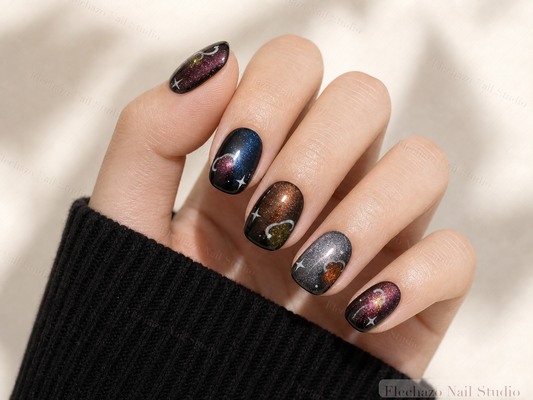 Dark Cat Eye Galaxy Press-On Nails worn on a model hand