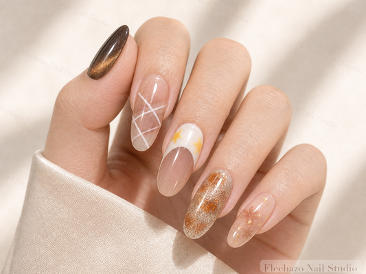 Black Gold Cat Eye Mixed Star Press-On Nails worn on a model hand