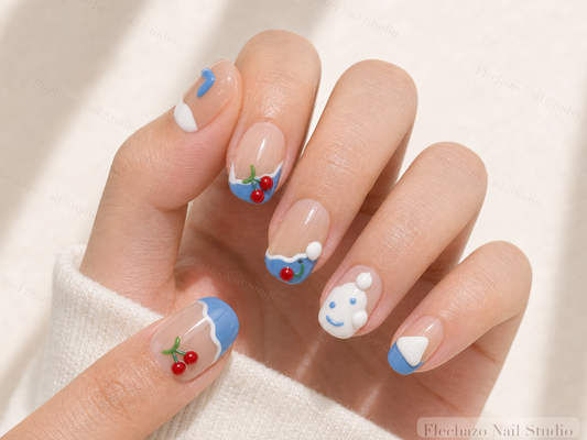 Nude Soft Blue Cherry White Press-On Nails worn on a model hand