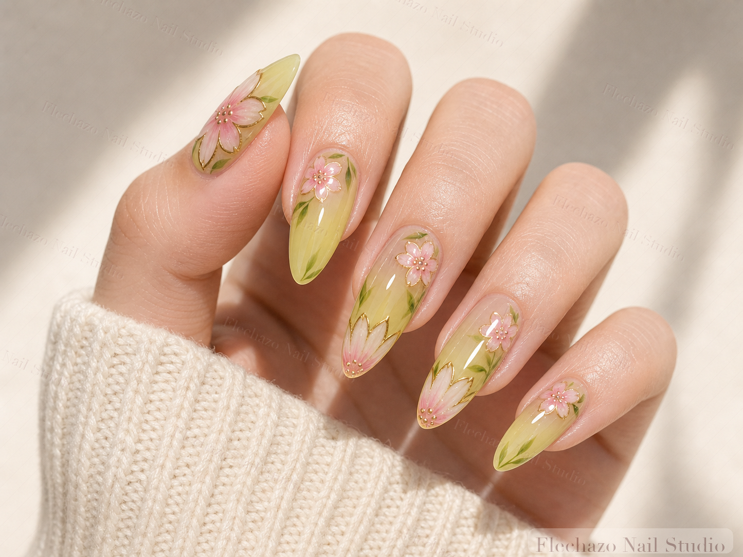 Sage Green Hand-Painted Floral Press-On Nails worn on a model hand