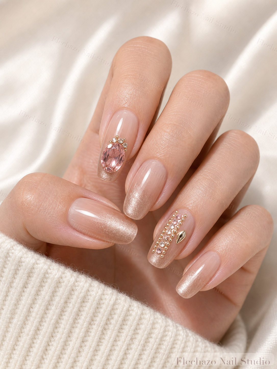 Blush Pink Crystal Chain Press-On Nails worn on a model hand