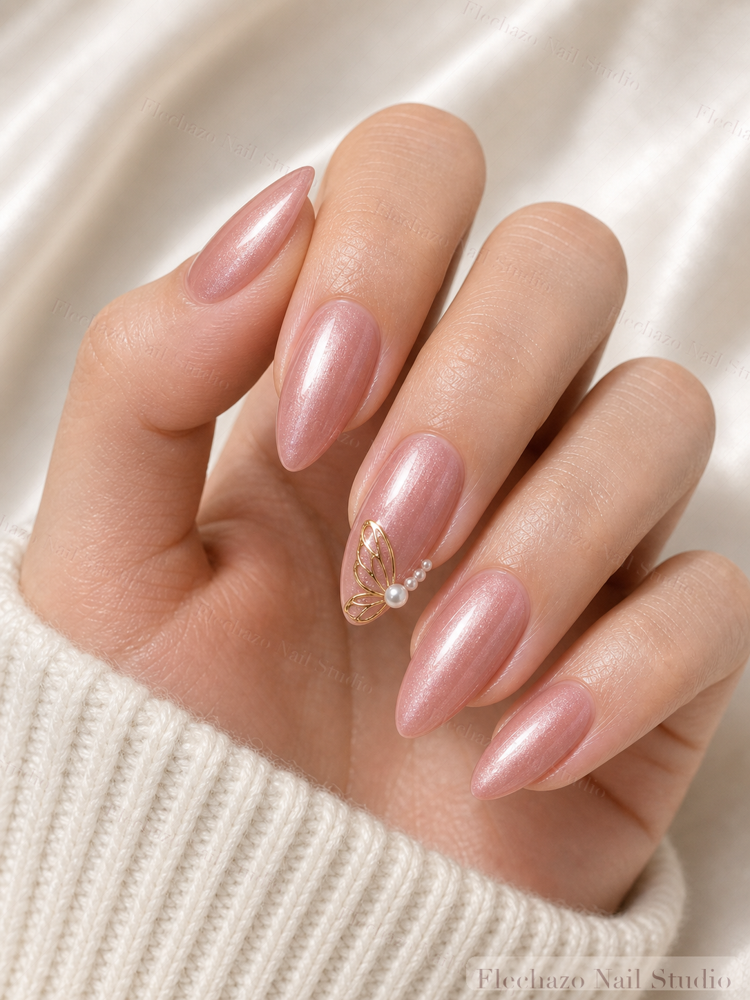Mauve Nude Gold Butterfly Press-On Nails worn on a model hand