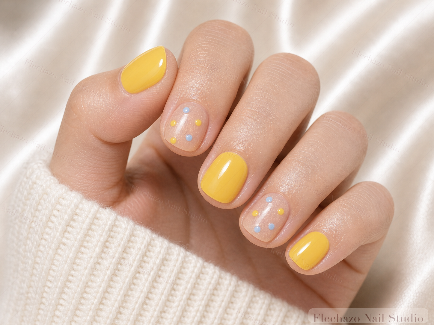 Sunny Yellow Minimalist Press-On Nails worn on a model hand