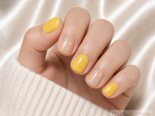 Sunny Yellow Minimalist Press-On Nails worn on a model hand