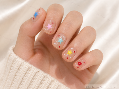 Nude Colorful Star Cloud Press-On Nails worn on a model hand