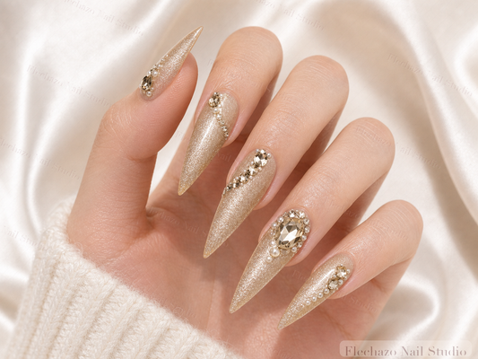 Champagne Pearl Celestial Stiletto Press-On Nails worn on a model hand