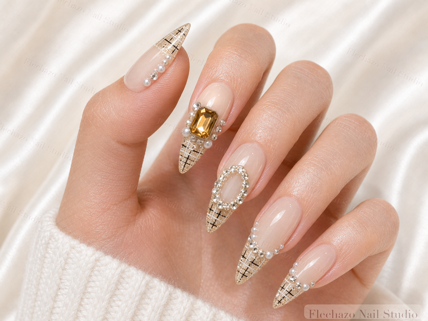 Champagne Plaid Rose Crystal Stiletto Press-On Nails worn on a model hand